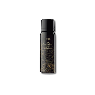 Oribe hair spray bottle on a white background