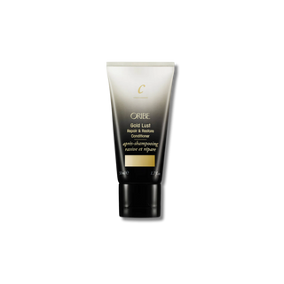 Oribe Gold Lust Repair & Restore Conditioner tube on a white background