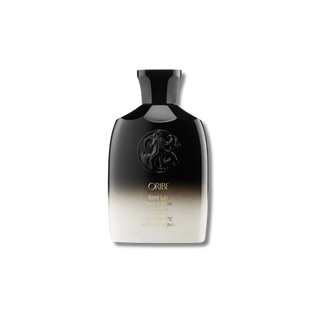 Oribe hair product bottle with gradient design on a white background