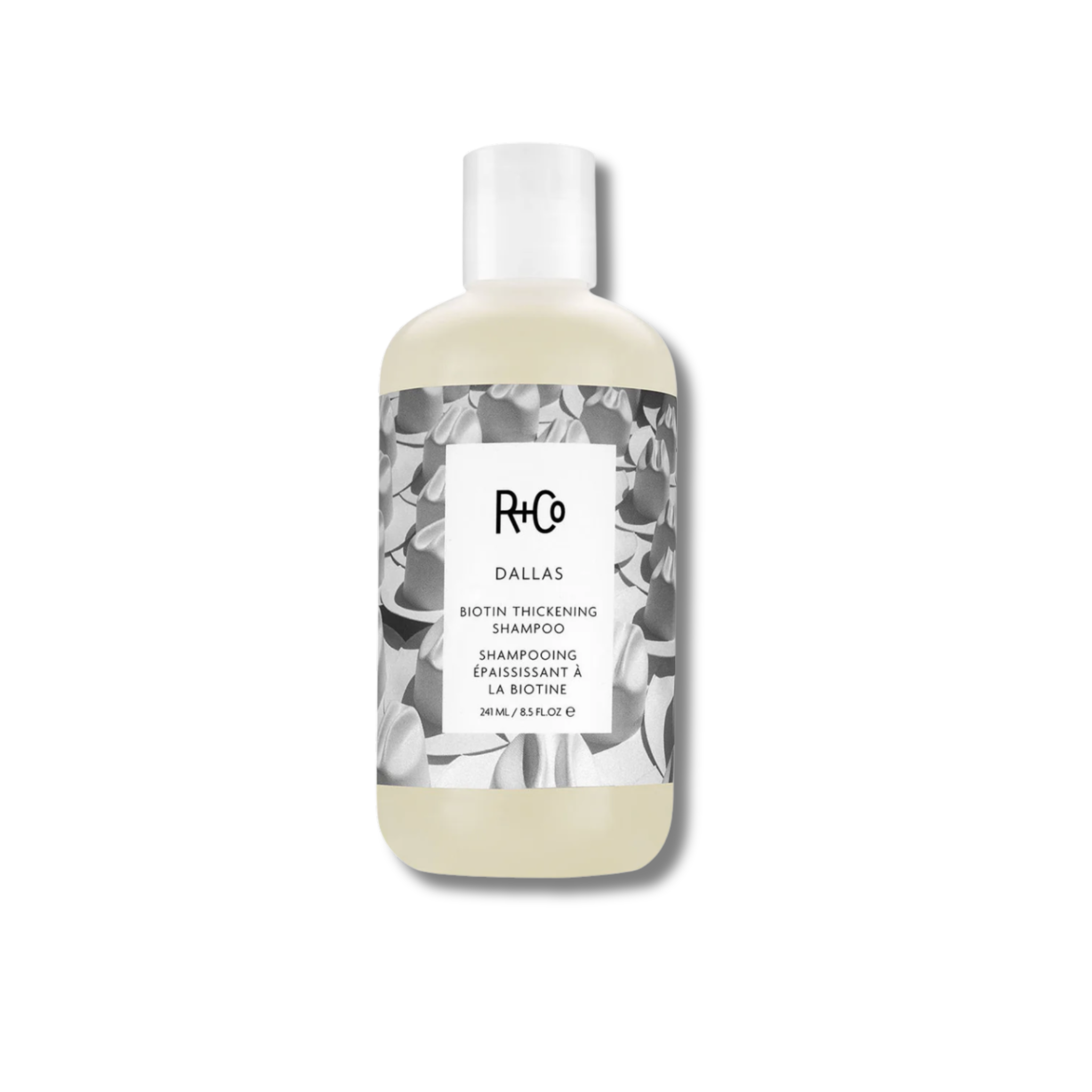 Shampoo bottle with floral design on a white background
