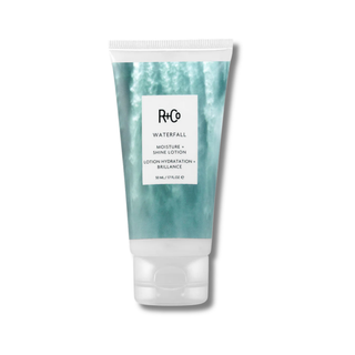 Tube of R+Co Waterfall Moisture + Shine Lotion on a white background