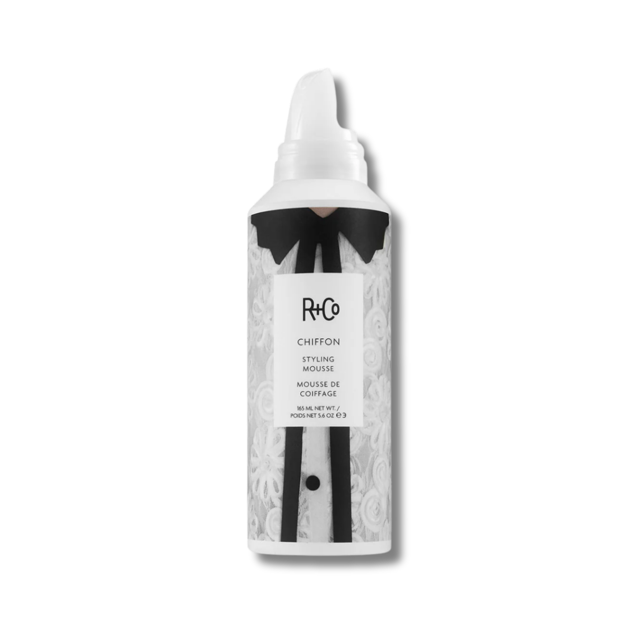 Hair mousse bottle with black and white design on a white background
