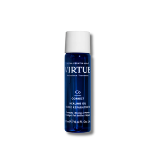 Blue bottle of Virtue Co Correct Healing Oil on a white background