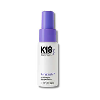 K18 AirWash dry shampoo bottle with purple cap on a white background