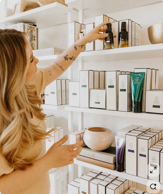 Woman browsing products on a shelf in a store